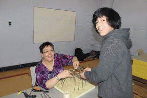 Building a wigwam at Mikinaak Onigaming Family Math Night