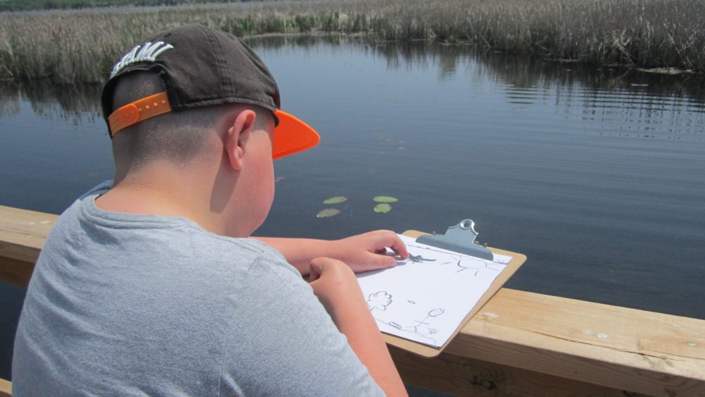 Student of Curve Lake First Nation School partaking in environmental inquiry