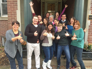 A group of teachers giving the thumbs up