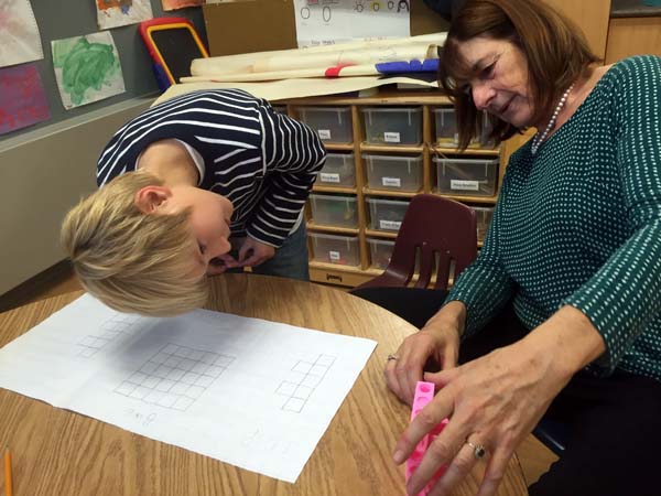Joan Moss and a Robert Moore student look at the shape from a different perspective