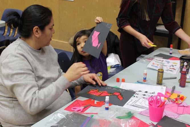 Student and parent playing with Tengrams