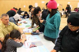 Students making paper planes