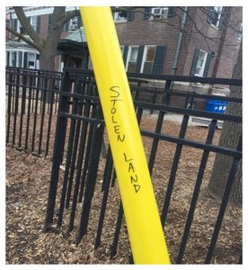 "Stolen land" written on a street pole