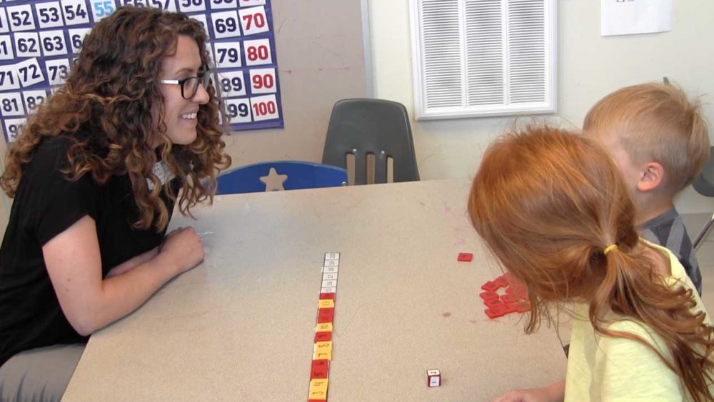Teacher playing the number line game with her students