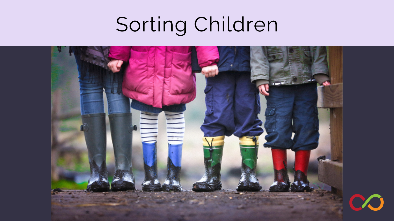 Four children stand holding hands with different rain gear on. The feature image for the Sorting Children activity.